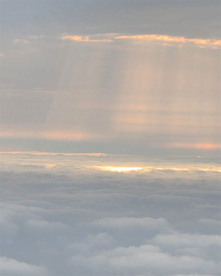 ... With clouds above and clouds below;The sunrays paint their own... (Arabian Gulf)