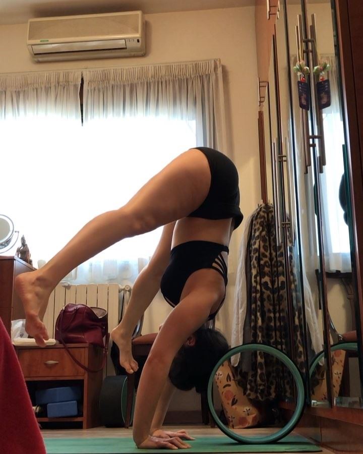 Working on pressing into handstand with my friend the yoga wheel! This...