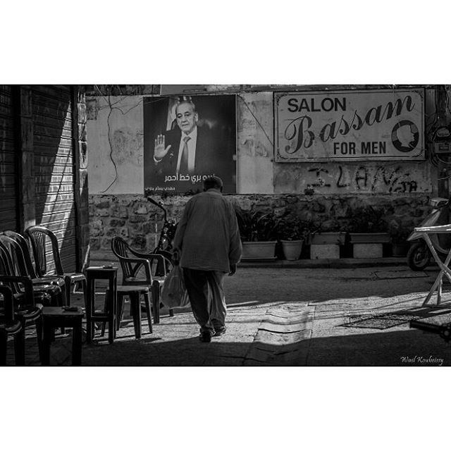 السلطة في وجه الفقير bnw  suburban  walking  man  blackandwhite  tyre ... (Tyre, Lebanon)