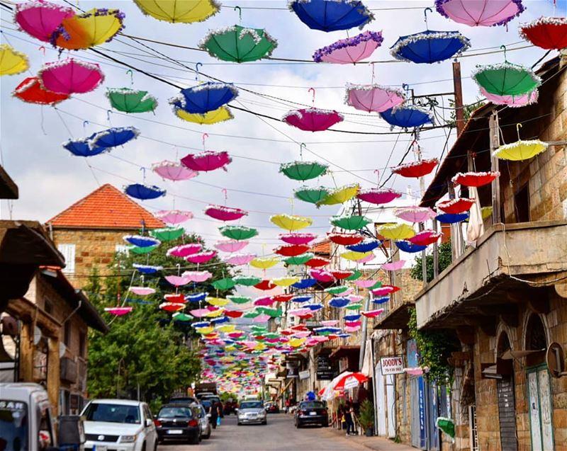  حصرون 🌸  وردة_الجبل  umbrellas  colors  colorful  oldhouses  redroof ... (Hasroun)